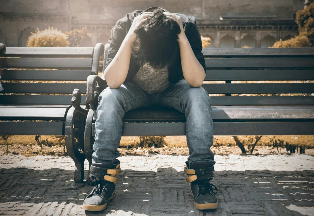 Loneliness and Isolation in a World That’s Always “On” 1 Man sitting alone, lonely, isolation, isolated, social anxiety,